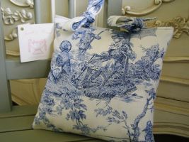 Our traditional genuine French Emillie toile cushion measures 10" x 10" and complemented with a pale thick silken blue fabric to the rear and finished off with two bows on the top. Price: &pound;13.54